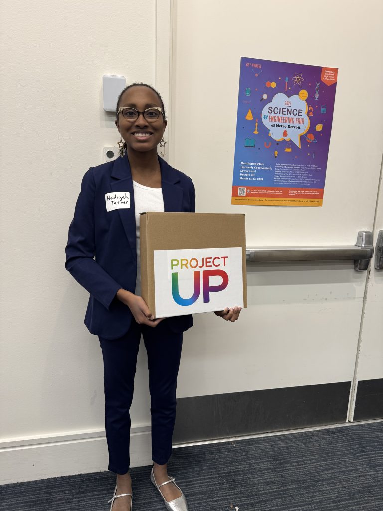 Nadiyah holding laptop