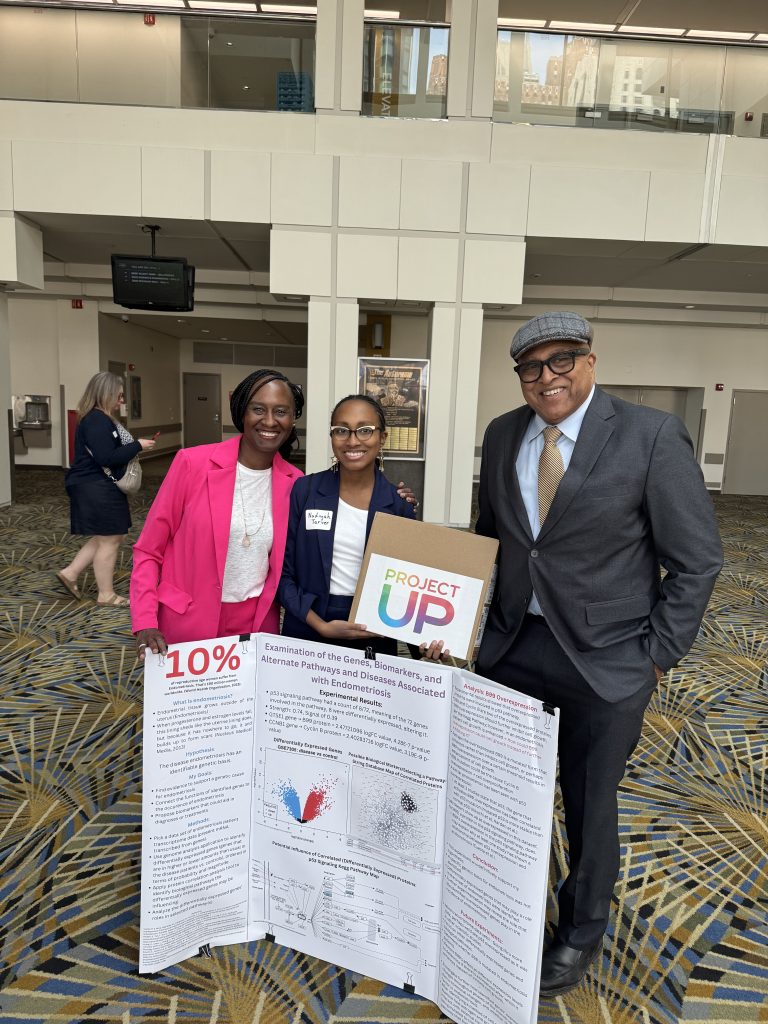 Nadiyah and parents with her winning science fair project
